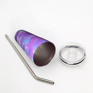 Stainless steel tumbler with a colorful pattern, metal straw, and clear lid on a white background