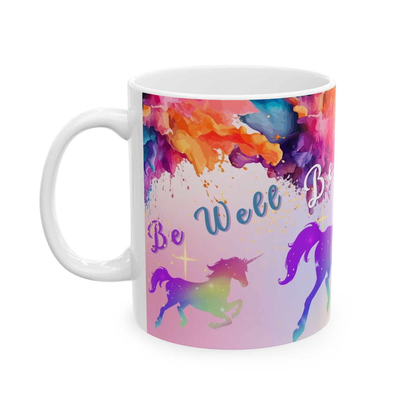 A white ceramic mug featuring a vibrant, colorful wrap-around print with watercolor splashes, silhouettes of unicorns, and the text 'Be Well Be Beautiful' in blue script.