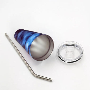 Marbled blue and gray tumbler with a metal straw and clear lid on a white background