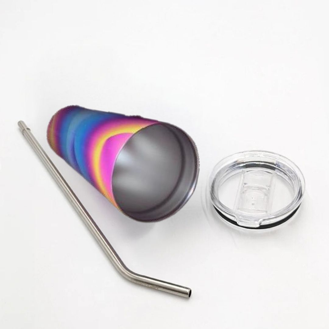 Colorful tumbler with a metal straw and clear lid on a white background