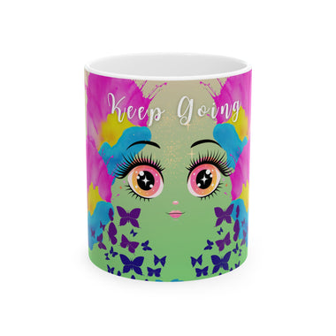 Mug with colorful design featuring eyes, butterflies, and 'Keep Going' text on a white background